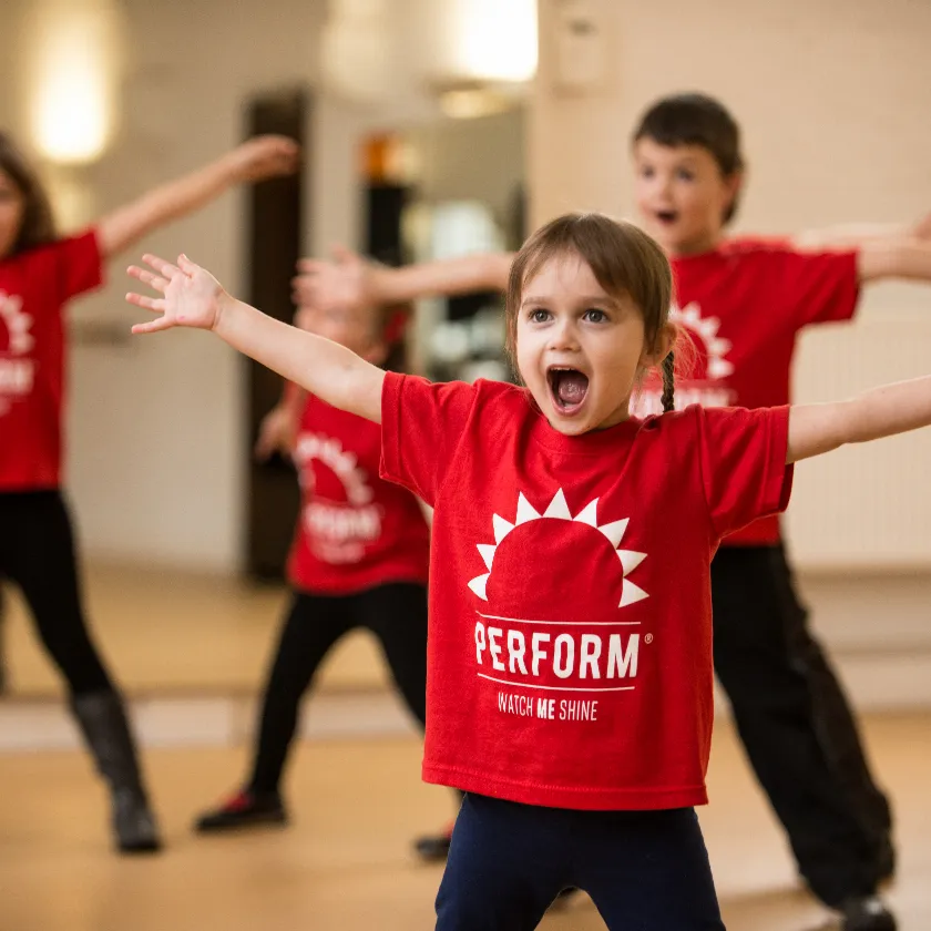 Children performing in a dance class